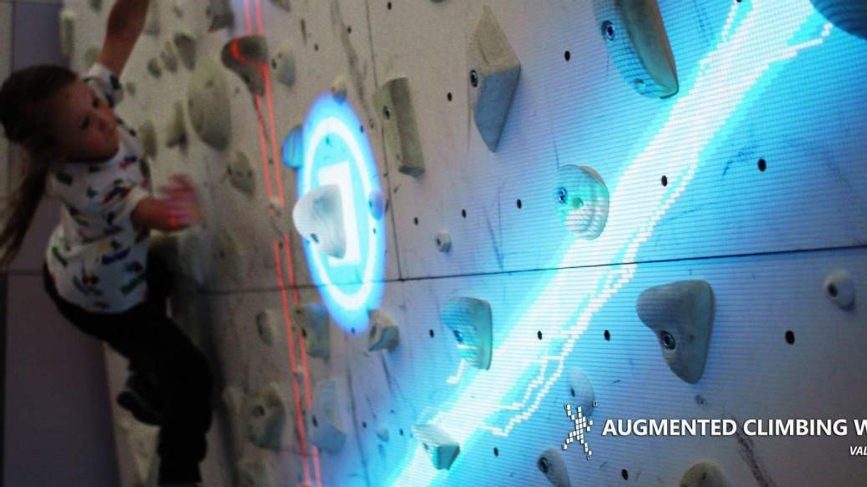 girl climbing valo motion augmented climbing wall