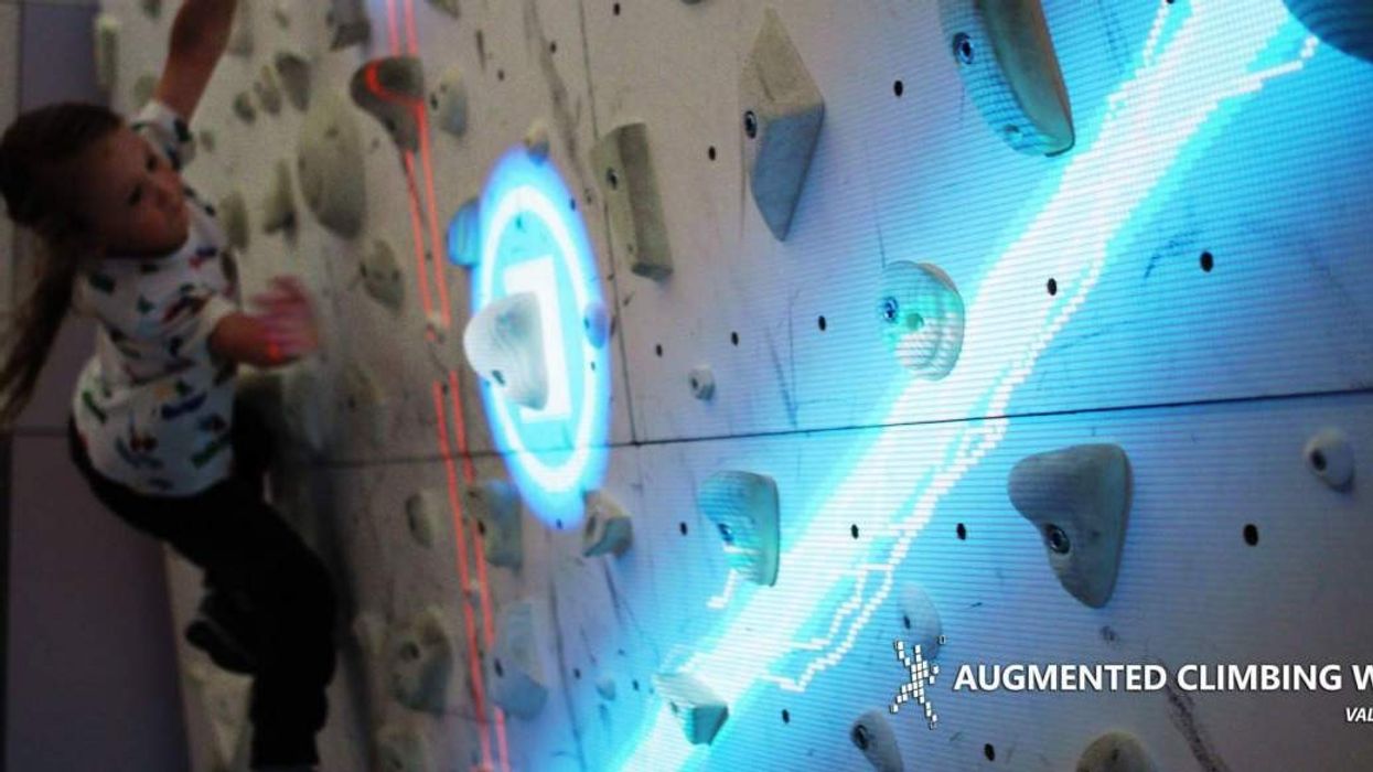 girl climbing valo motion augmented climbing wall