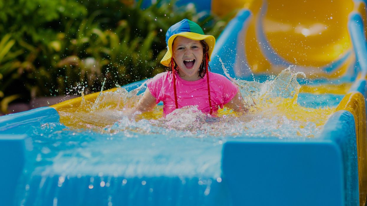 girl-laughing-on-water-slide