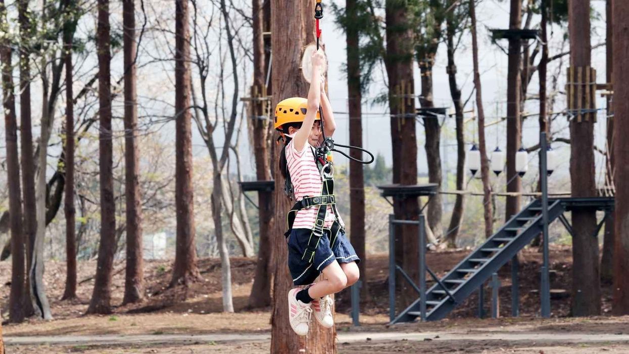 girl on aerial line at lotte arai resort japan