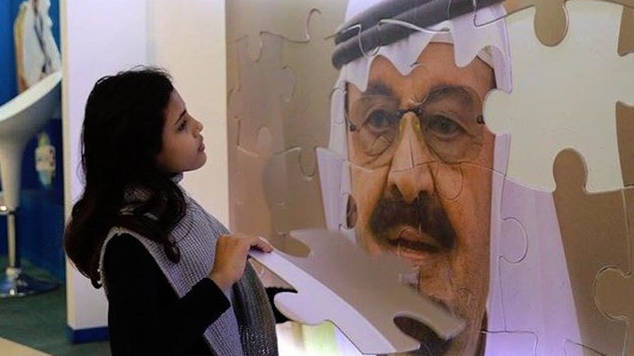 girl with jigsaw piece king abdullah exhibit 1