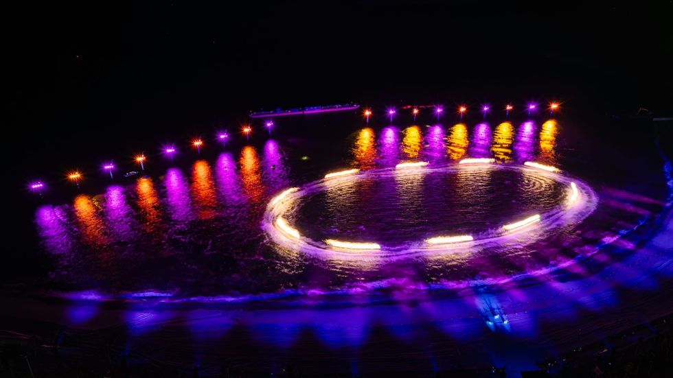 Glowing lights under the water at Symphony of the Green Island, C\u00e1t B\u00e0 Island