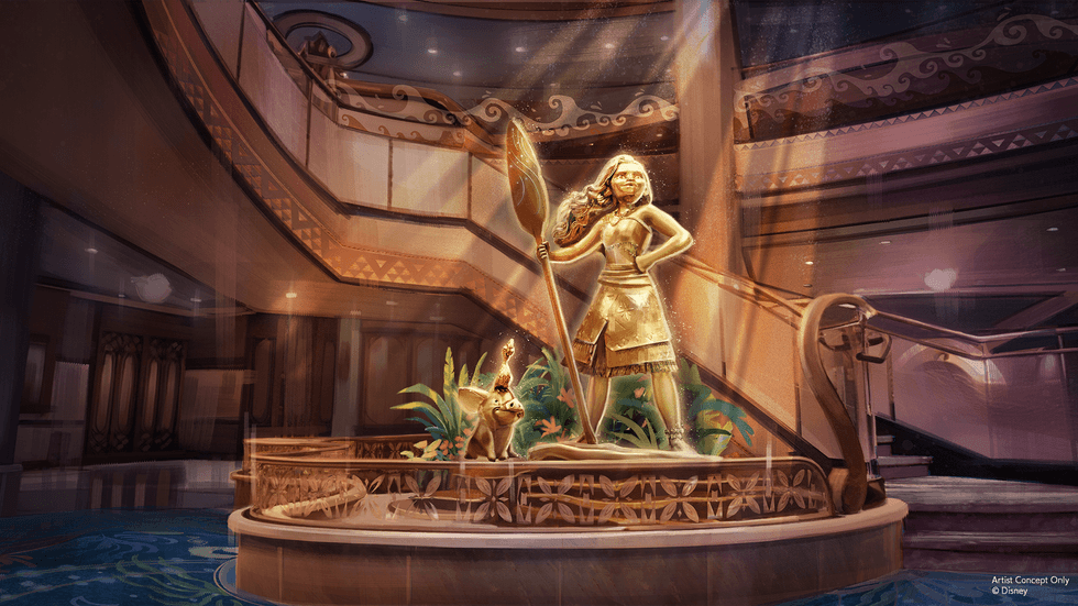 Golden statue of Moana with an oar in a grand atrium with plants and staircase.