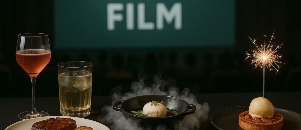 Gourmet meal and drinks served in a cinema with "FILM" on the screen in the background.