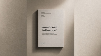 Gray book titled "Immersive Influence" on a textured surface.