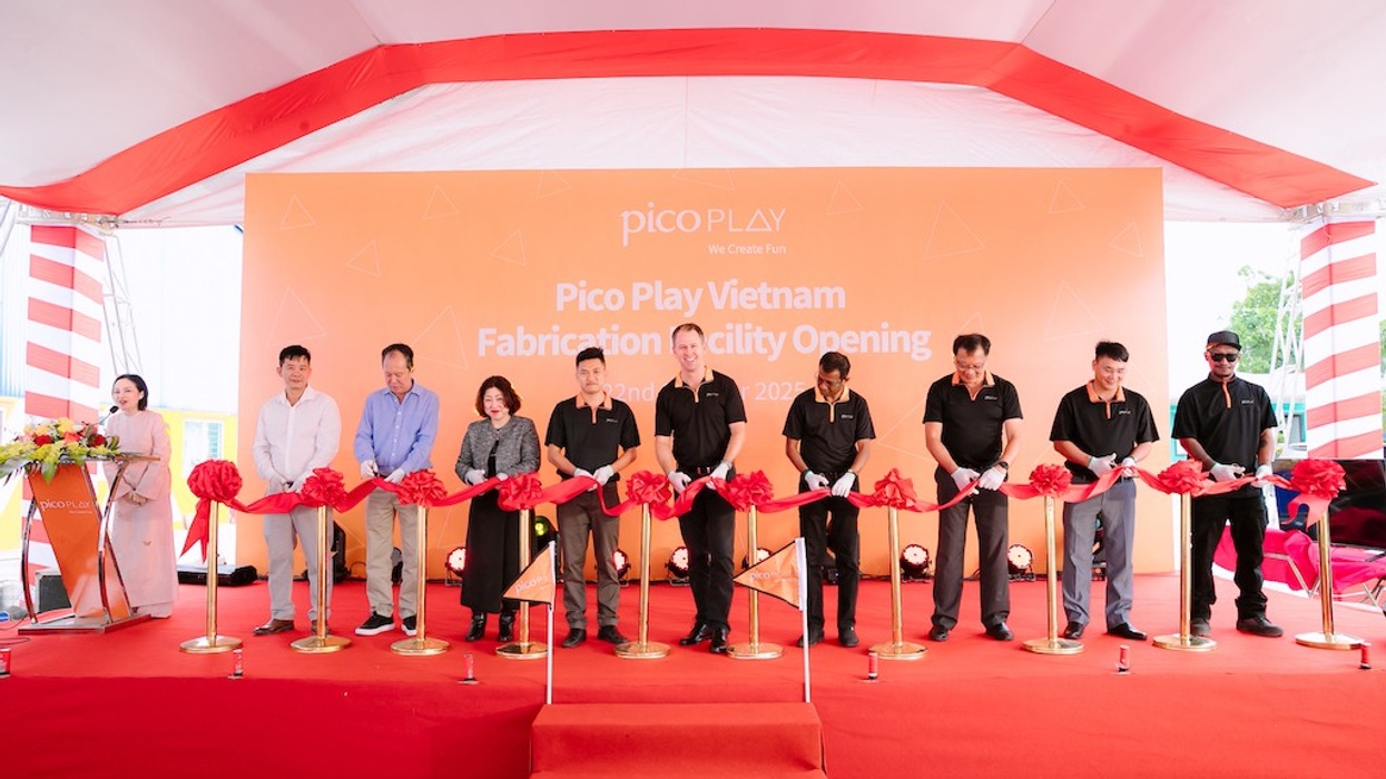 Group at a ribbon-cutting ceremony for Pico Play Vietnam facility opening.