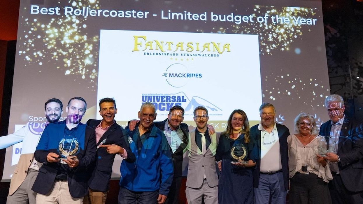 Group celebrates winning "Best Rollercoaster - Limited Budget of the Year" award.