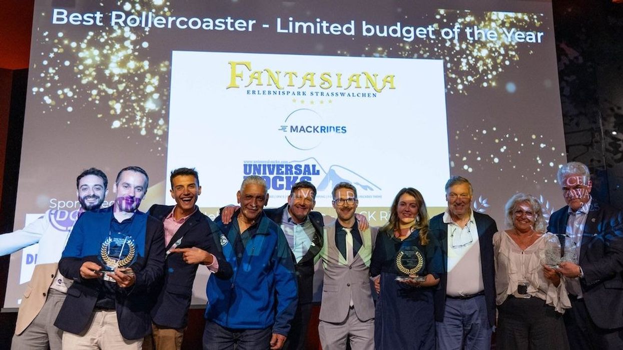 Group celebrates winning "Best Rollercoaster - Limited Budget of the Year" award.