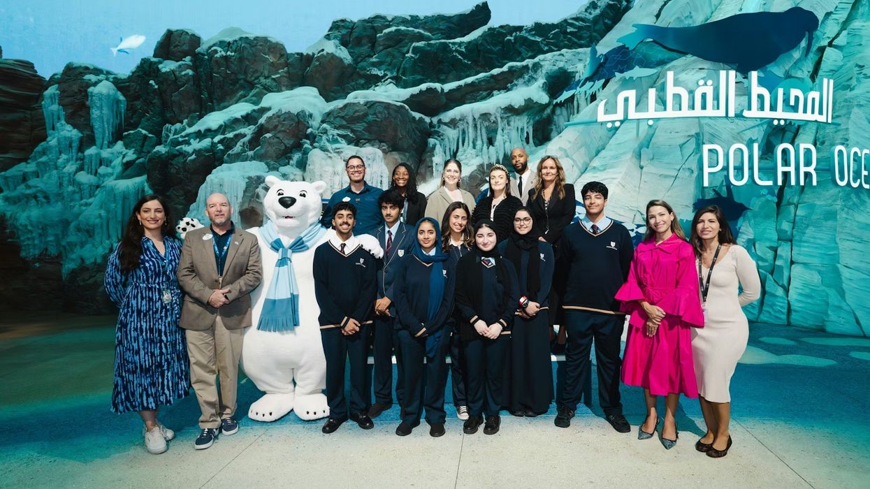 Group of people and a polar bear mascot at Seaworld Abu Dhabi