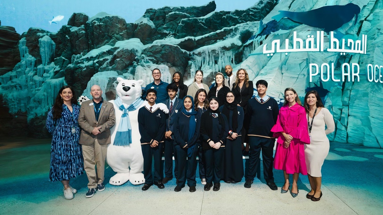 Group of people and a polar bear mascot at Seaworld Abu Dhabi