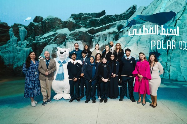 Group of people and a polar bear mascot at Seaworld Abu Dhabi