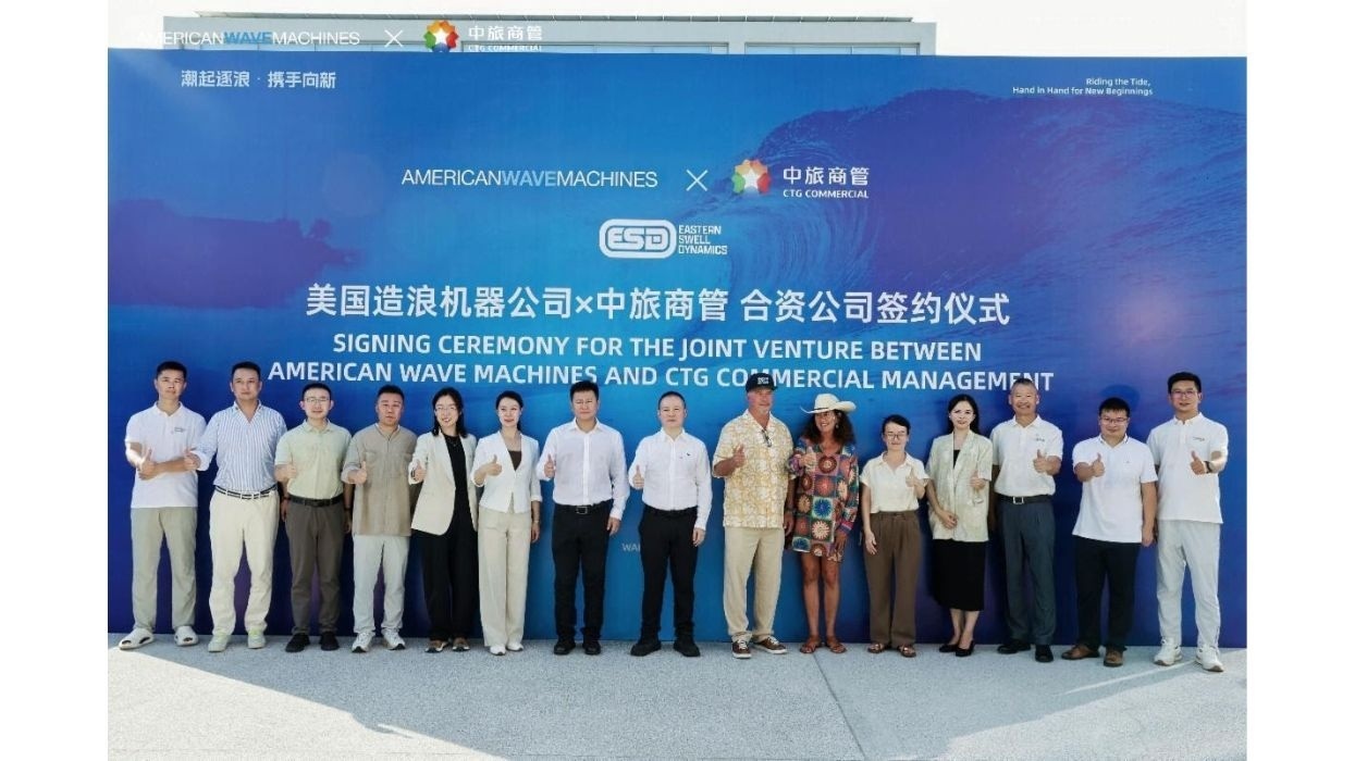 Group poses at signing ceremony for American Wave Machines and CTG partnership.