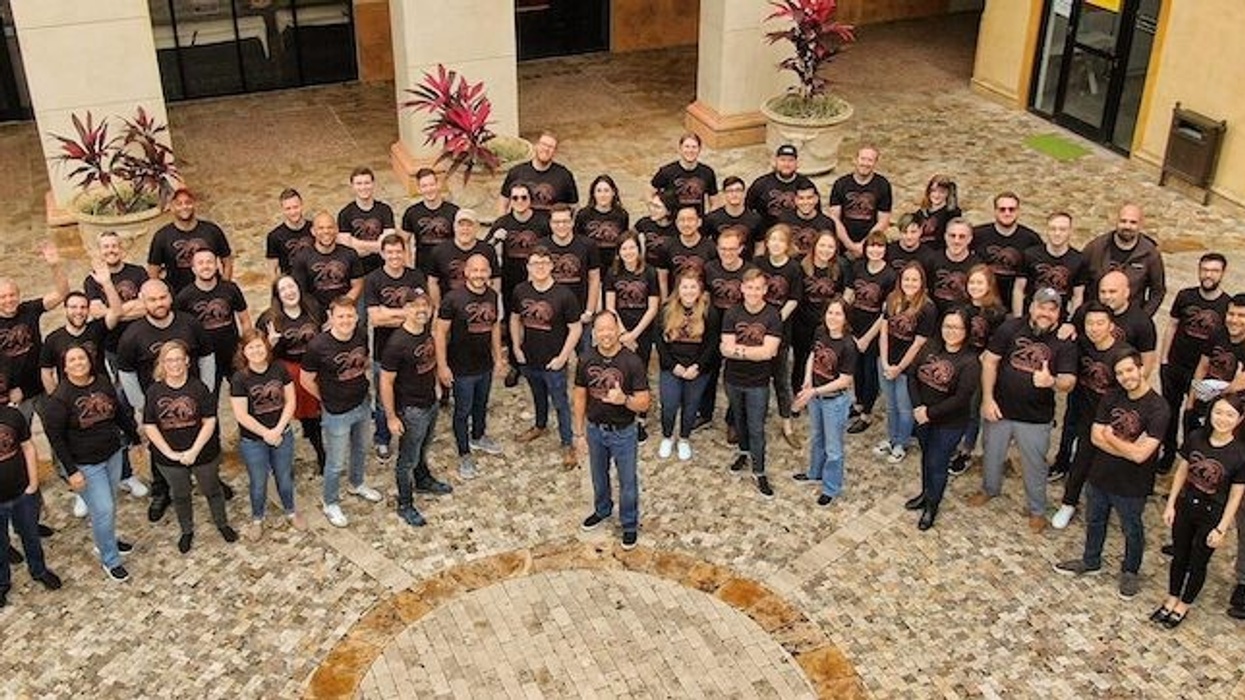 group shot of employees celebrating 20 years of Falcon's Creative Group