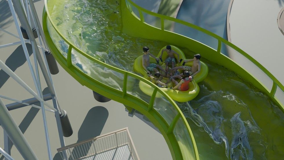 Group splashes down a green water slide in a yellow raft.