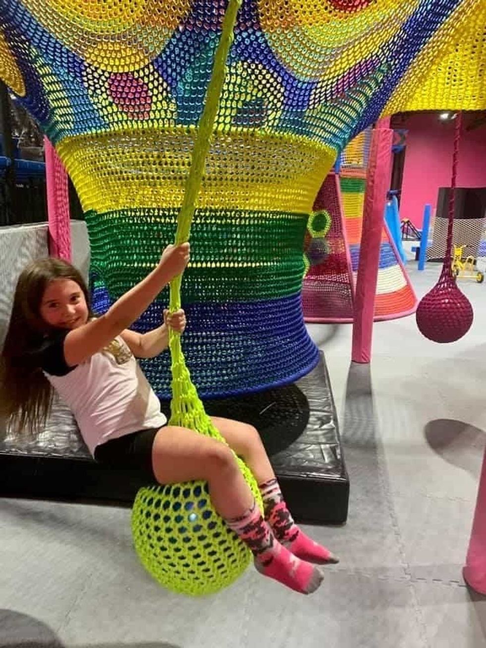 Guest swinging at Flying Squirrel park