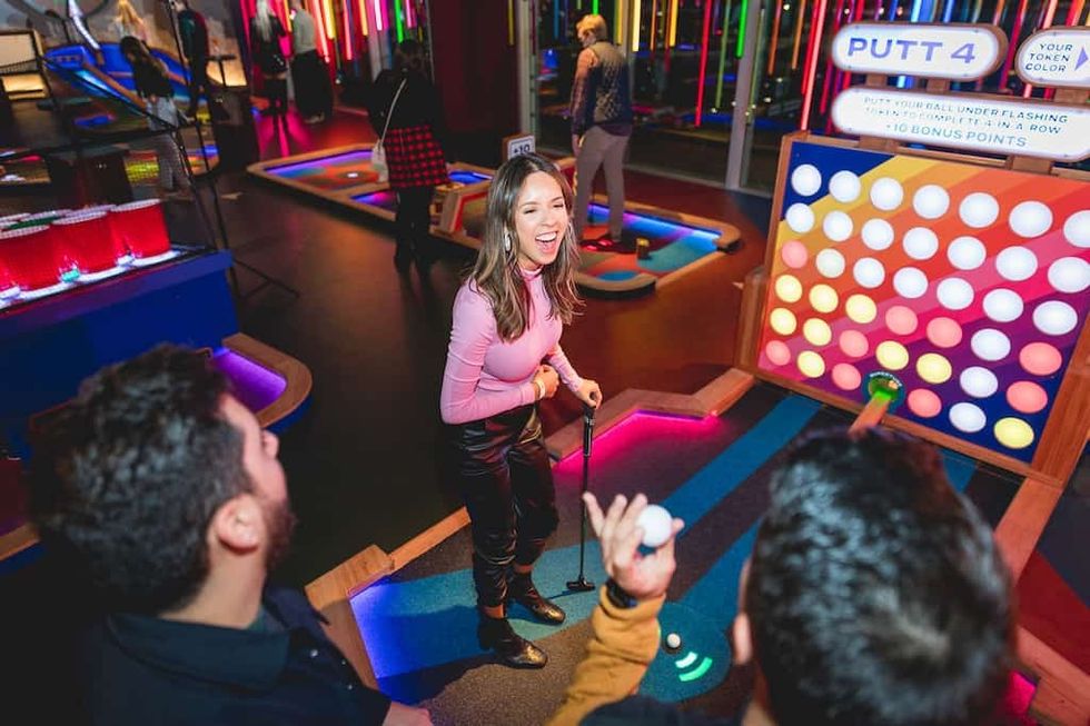 Guests at Puttshack golf experience
