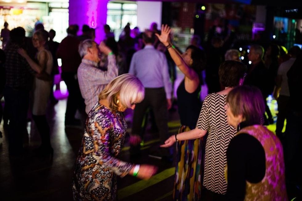 Guests dancing at National Archives' 60s Disco