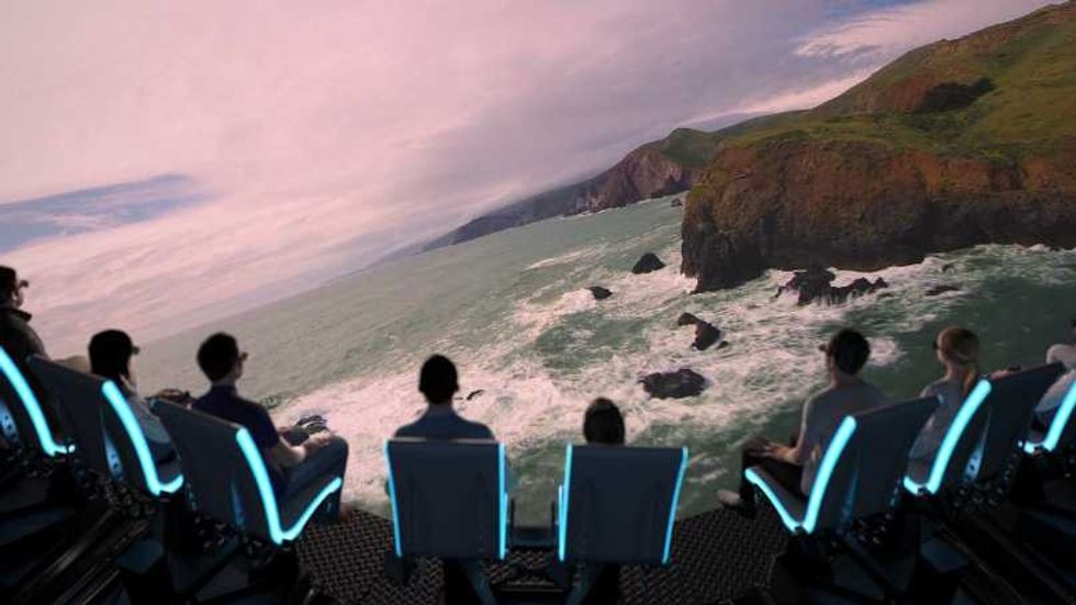 guests fly over rocky coastline in the flyer san francisco 3d flying theatre