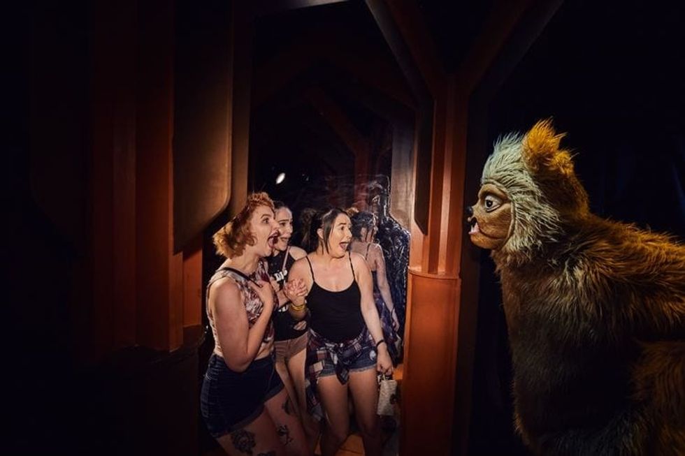 Guests getting scared at The Shining haunted house at Halloween Horror Nights
