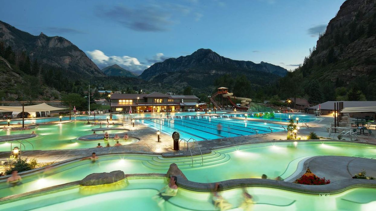 guests in ouray hot springs pool in the evening