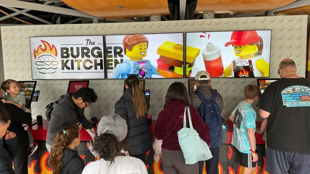 guests using self service kiosks at The Burger Kitchen at LEGOLAND California and Florida