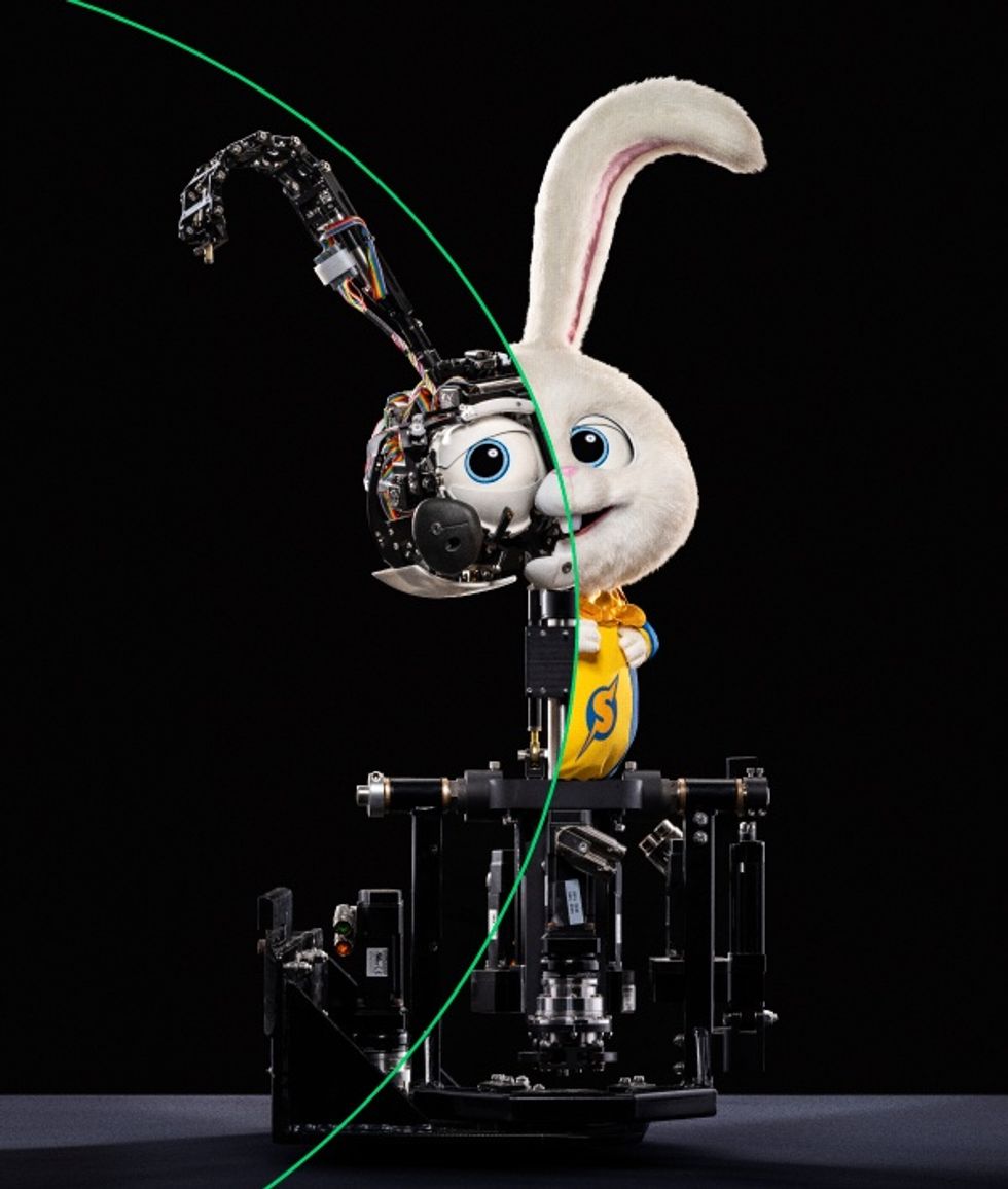 Half robot, half rabbit mascot, revealing internal mechanical structure.