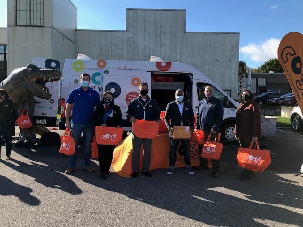 Handing Out COSI Learning Lunchboxes with Government Officials in Parma Ohio