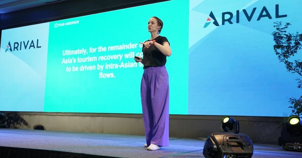 Hannah Pearson delivering her keynote presentation Travel Forward: The Outlook for Asia Arival Bangkok