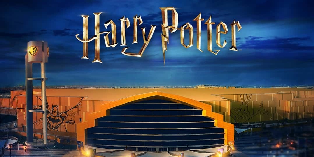 Harry Potter logo over Warner Bros. World Abu Dhabi entrance at dusk.