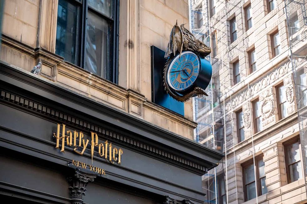 Harry Potter store facade with dragon clock in New York City.