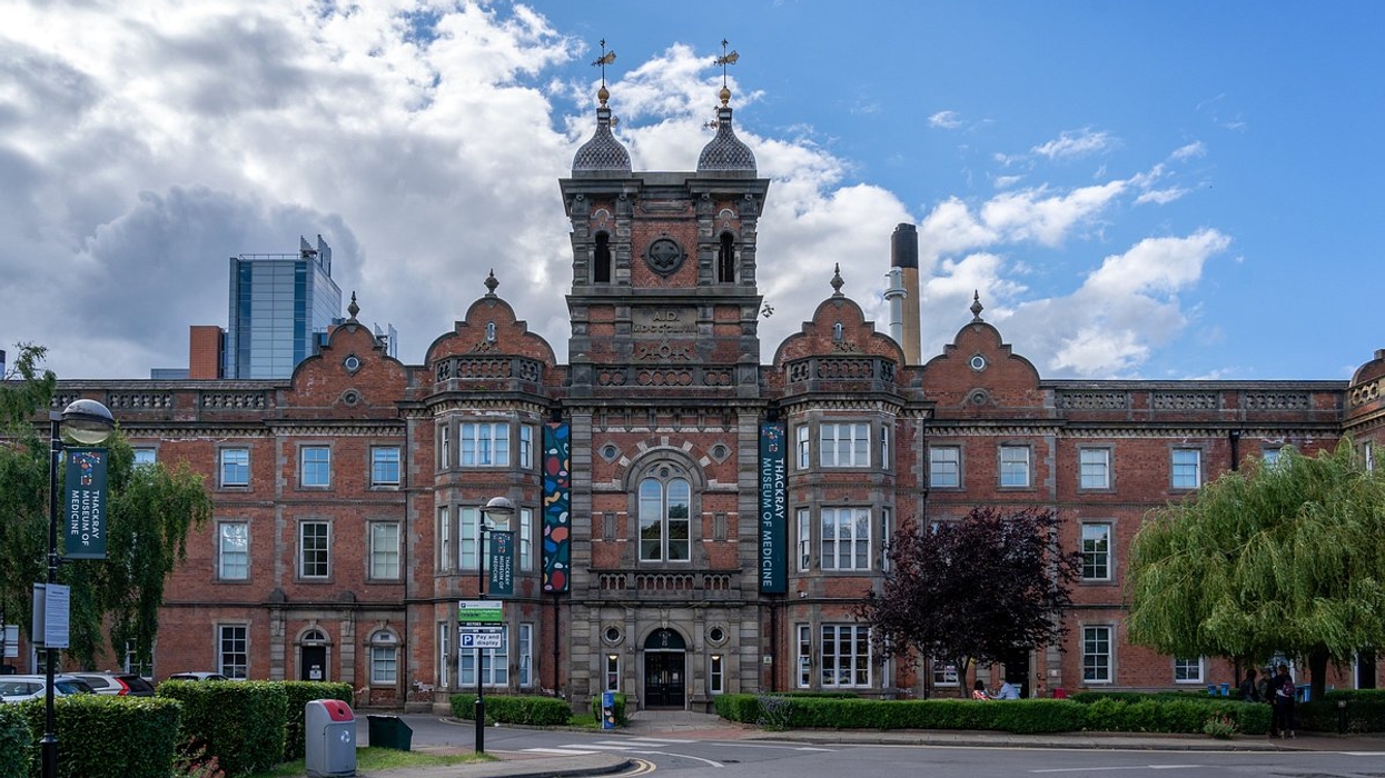Historic brick building called Thackray Museum of Medicine with central tower and ornate architectural details under a cloudy sky.
