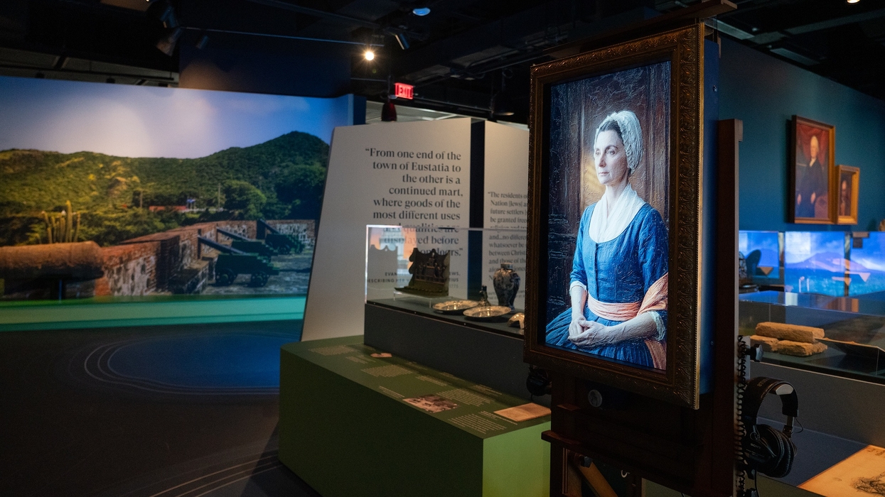 Historical museum exhibit with portraits and artefacts displayed at The Weitzman Museum