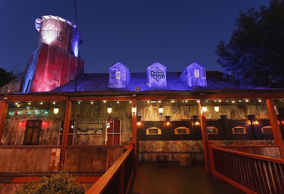 House of Blues exterior at night, lit with colorful lights against a clear sky.