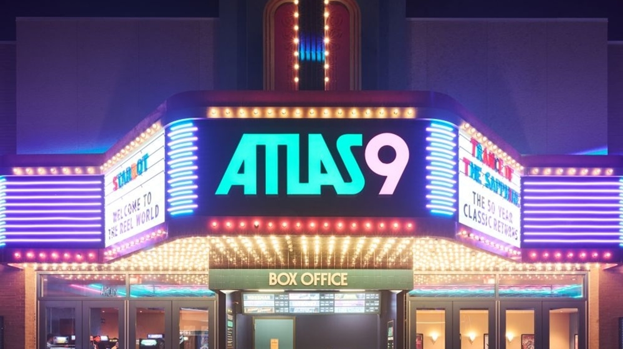 Illuminated theater marquee at night, with "Atlas 9" sign and colorful lights.