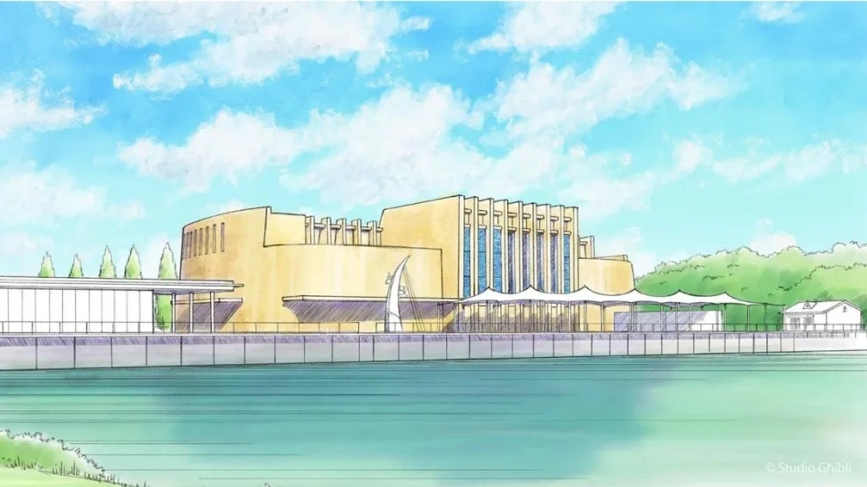Illustrated theater building by a riverside under a bright blue sky with fluffy clouds.