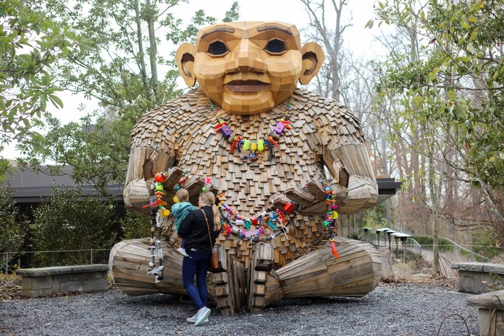 Imagine Exhibitions Trolls Atlanta Botanical Garden seated sculpture
