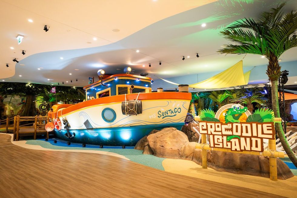 Indoor play area at Suntago Water World, with a boat and