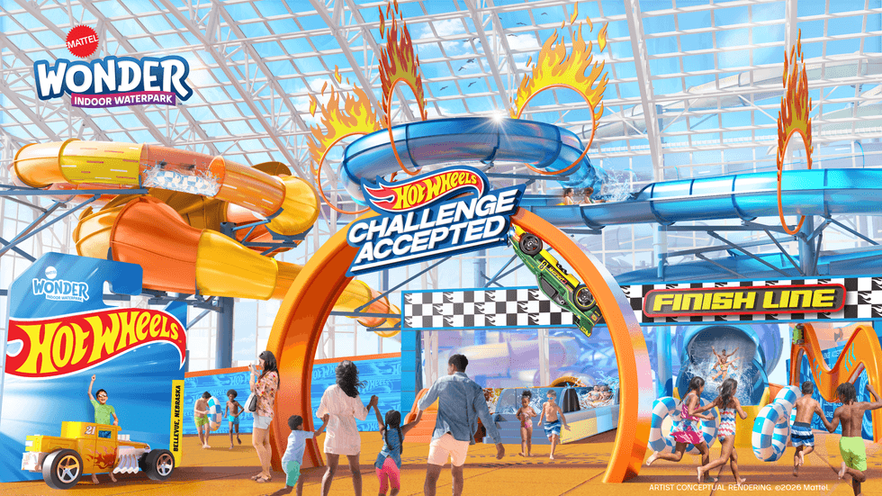 Indoor water park with Hot Wheels-themed slides and vibrant activities.