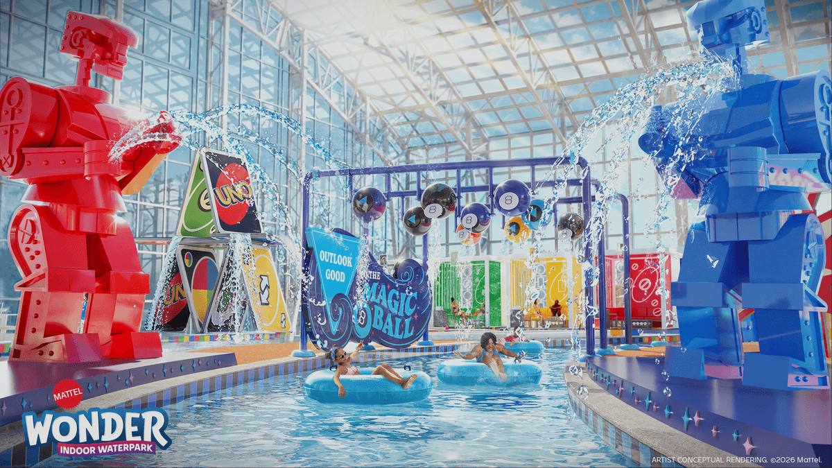 Indoor waterpark with giant robot statues and themed water features.