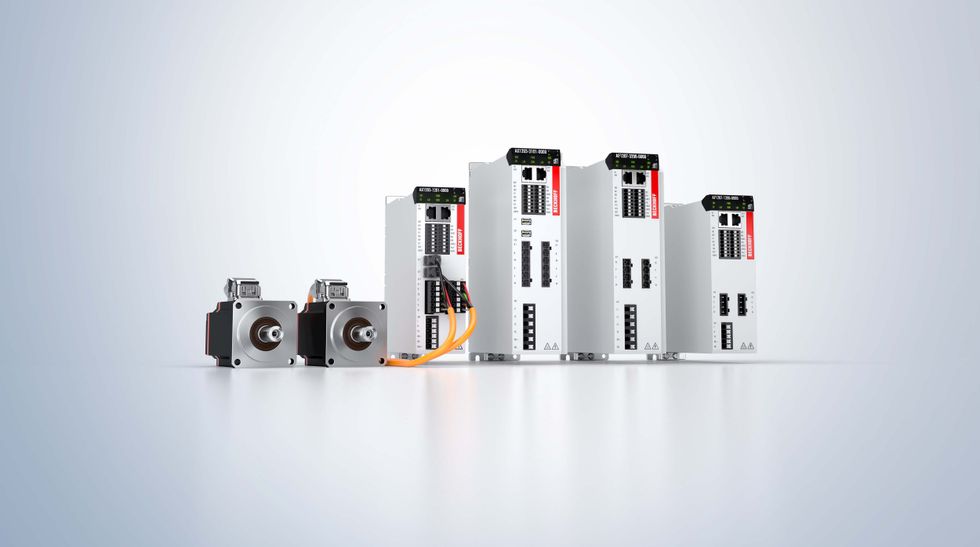 Industrial motor controllers and drives on a reflective surface.