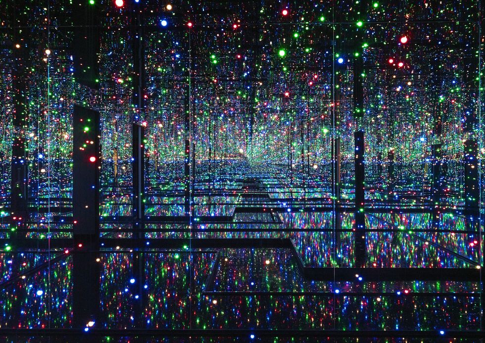 Infinity mirror room with colorful, reflecting LED lights.