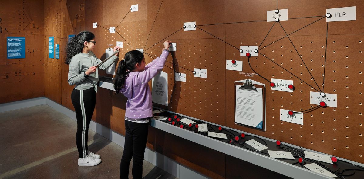 Intelligence-Factory-exhibit-Bletchley-Children-with-interactive-exhibit-credit-Andrew-Lee