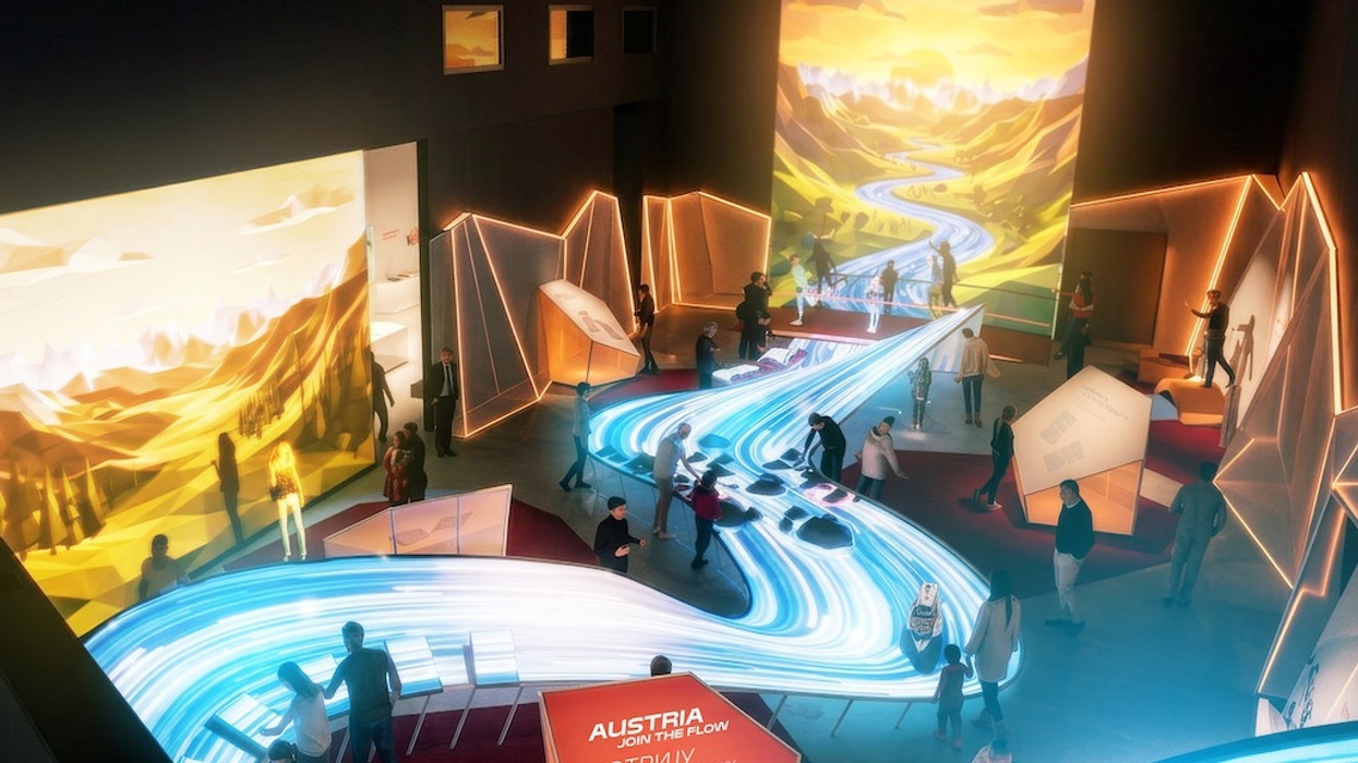 Interactive exhibit with illuminated stream and nature-themed projections.