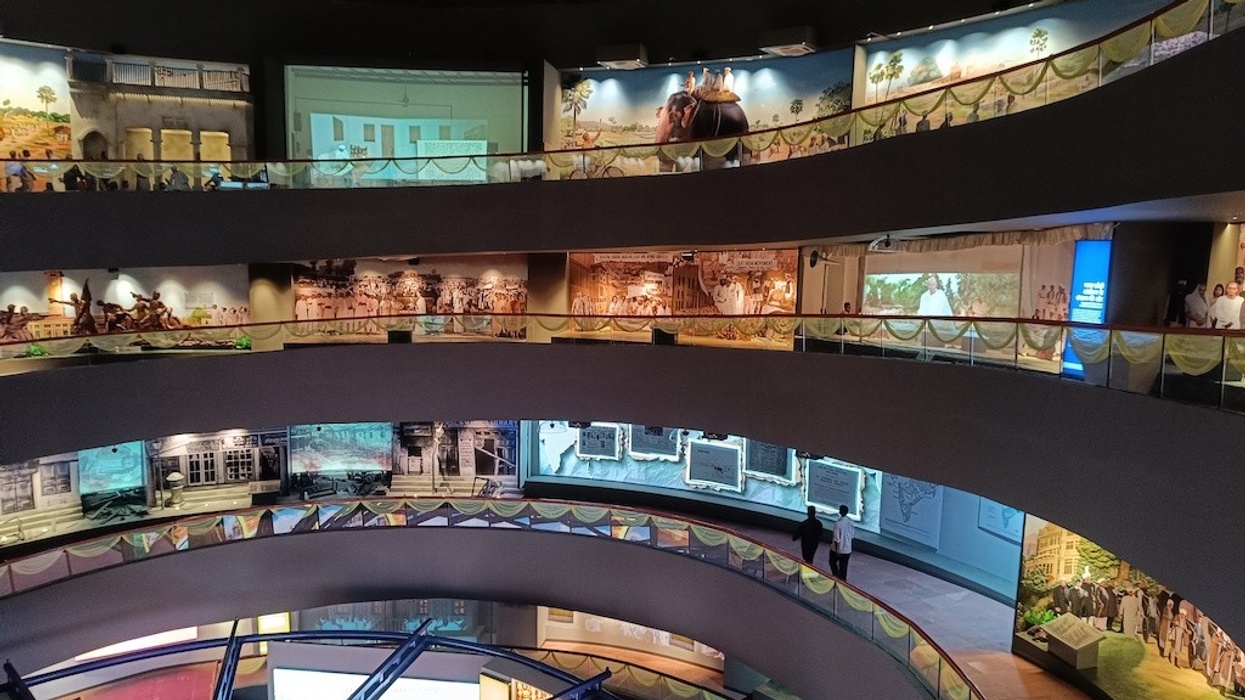 Interior of Bapu Tower Museum with spiraling walkways and vibrant displays.