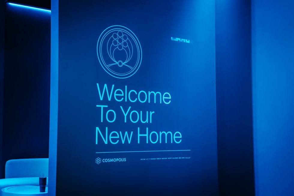 Interstellar Arc Blue-lit sign reading "Welcome To Your New Home" with a logo above.