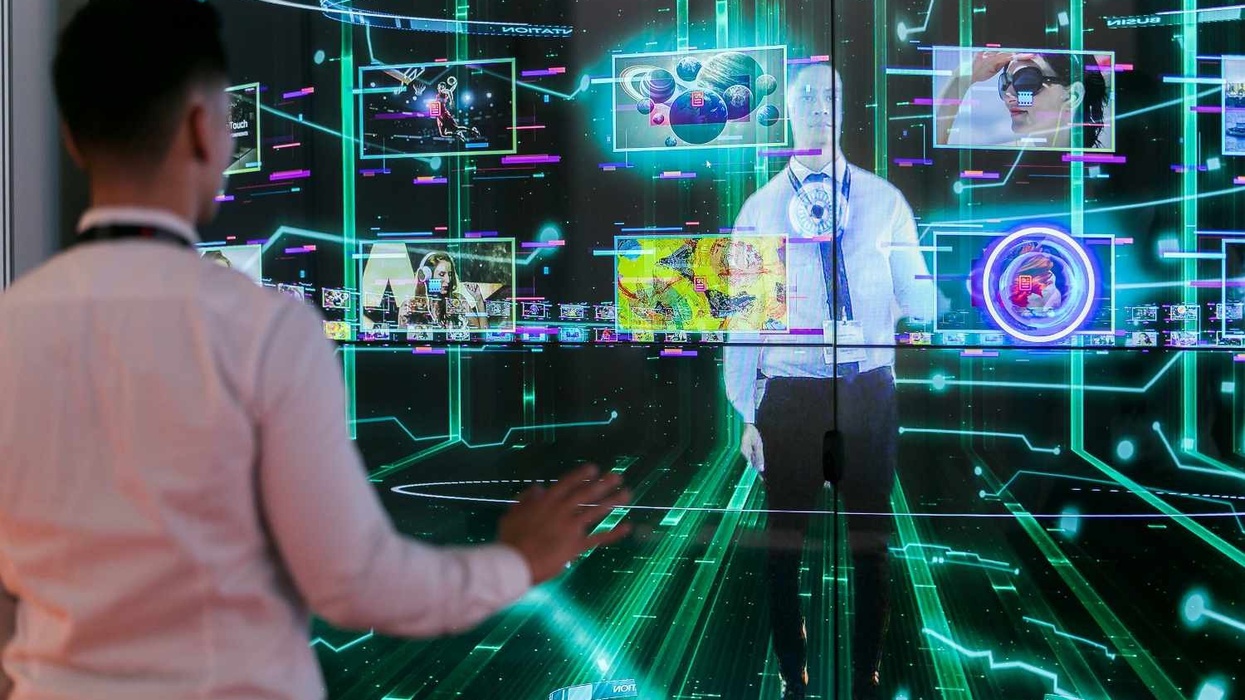 ISE 2018 - man stands in front of digital imagery