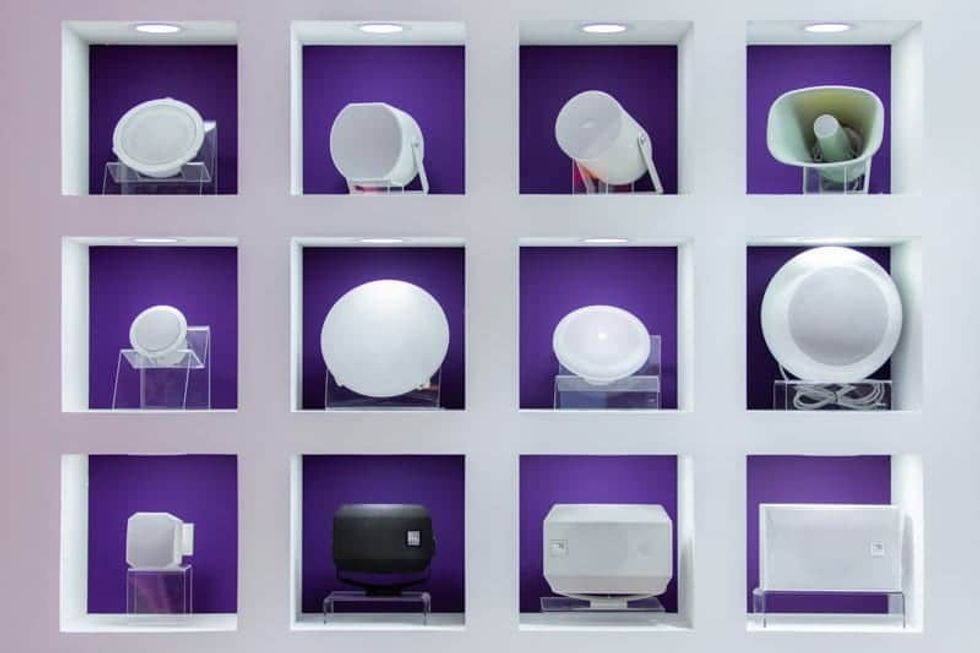 ISE 2019 speakers in shelves arranged like an art exhibit