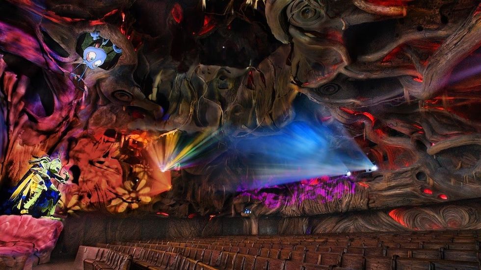 It\u2019s Tough to be a Bug 4D theater attraction. Colorful, fantasy-themed theater interior with elaborate designs and vivid lighting effects.