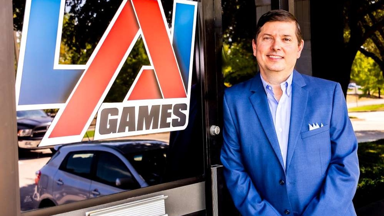 John Bugh standing in front of LAI Games sign
