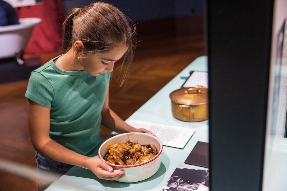 Julia Child Exhibit Visitor with food